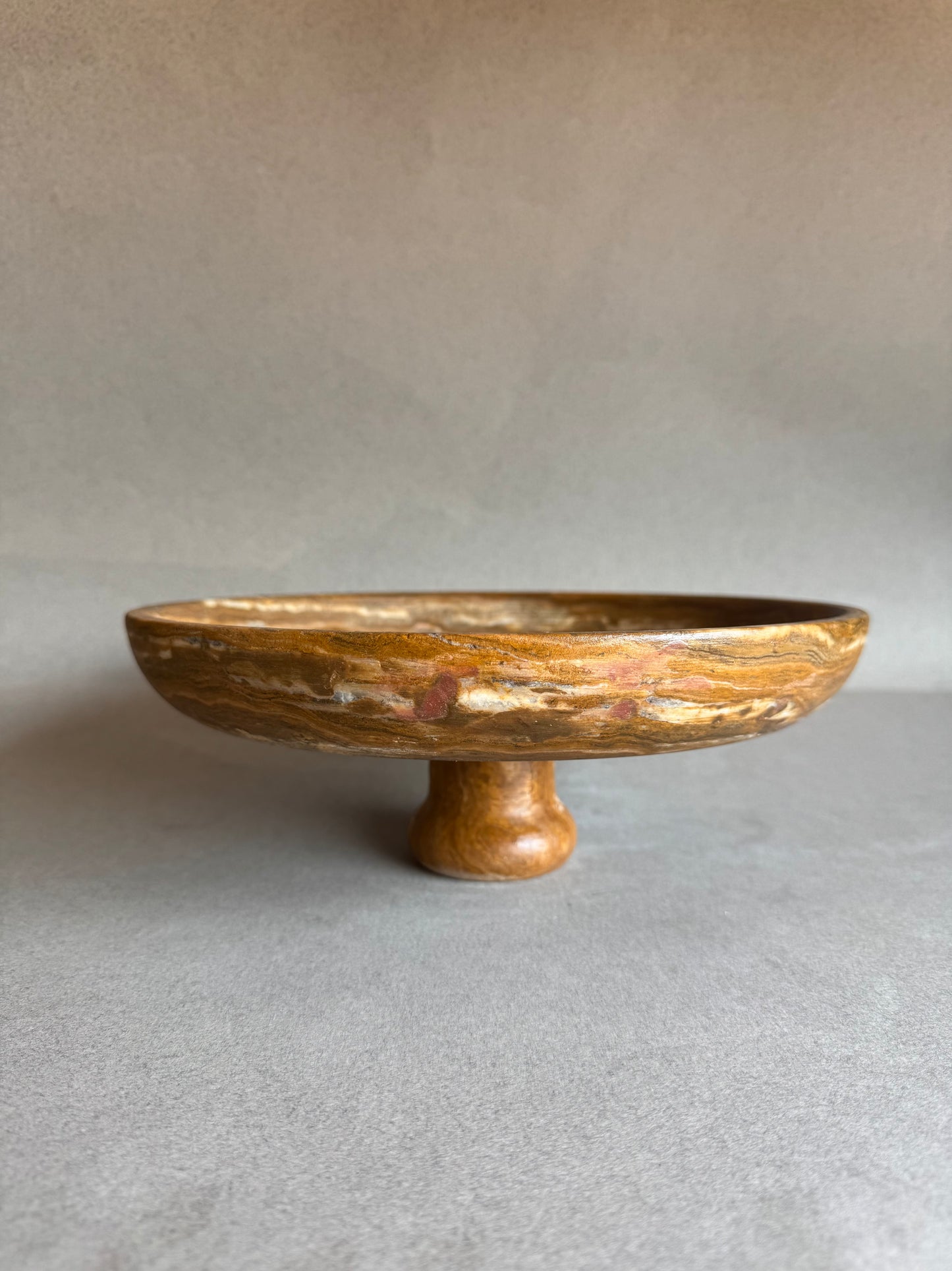 Stone bowl on a gray background