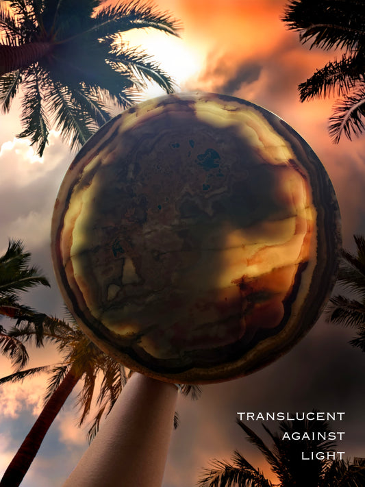 Interior detail of sculptural onyx pedestal bowl highlighting translucent stone layers and natural mineral movement