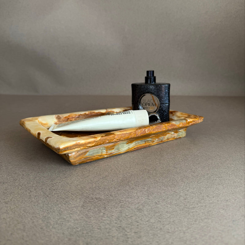 Minimal onyx stone tray for bathroom vanity or dresser featuring earthy brown and ivory tones
