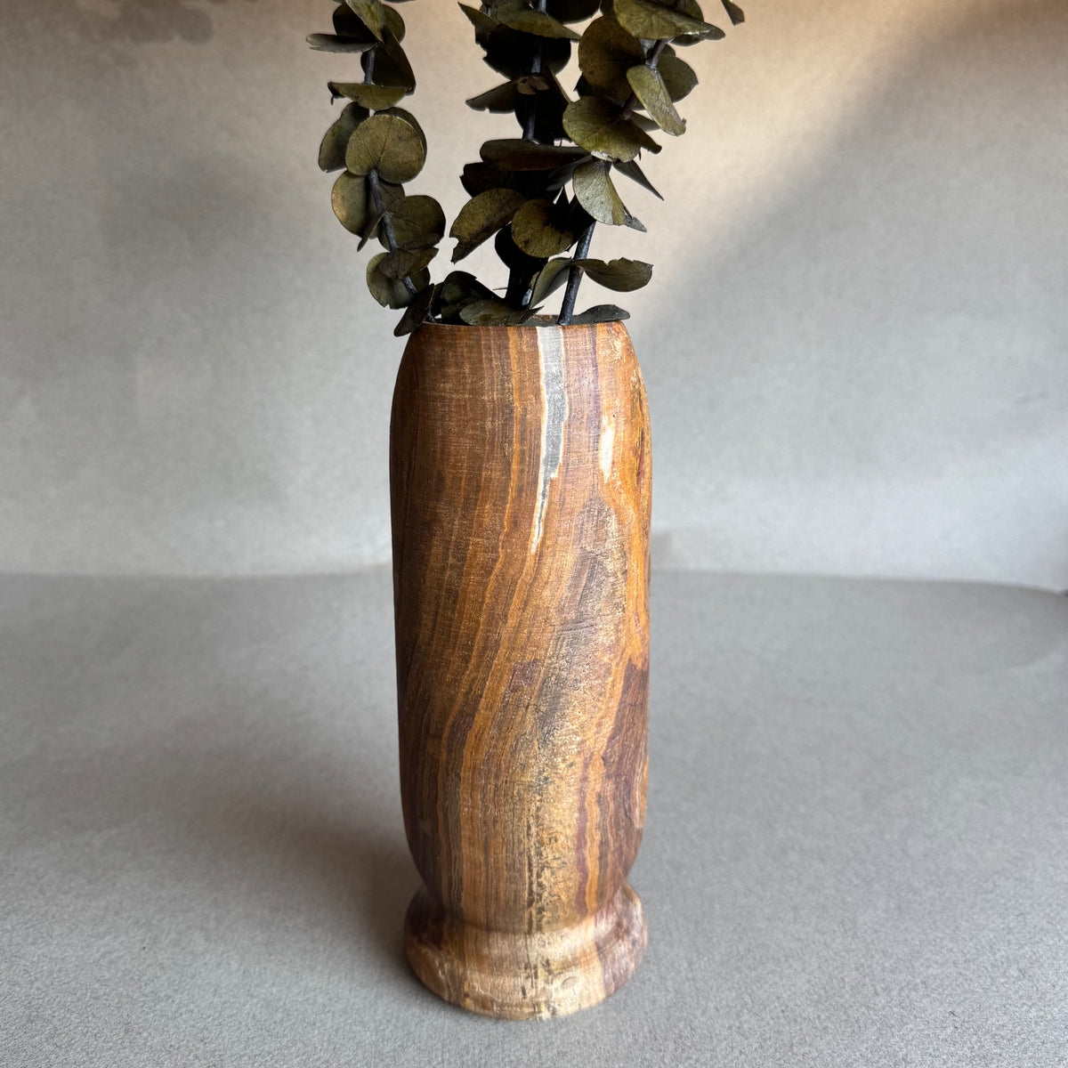 Earthy home decor accent with hand-carved onyx vase
