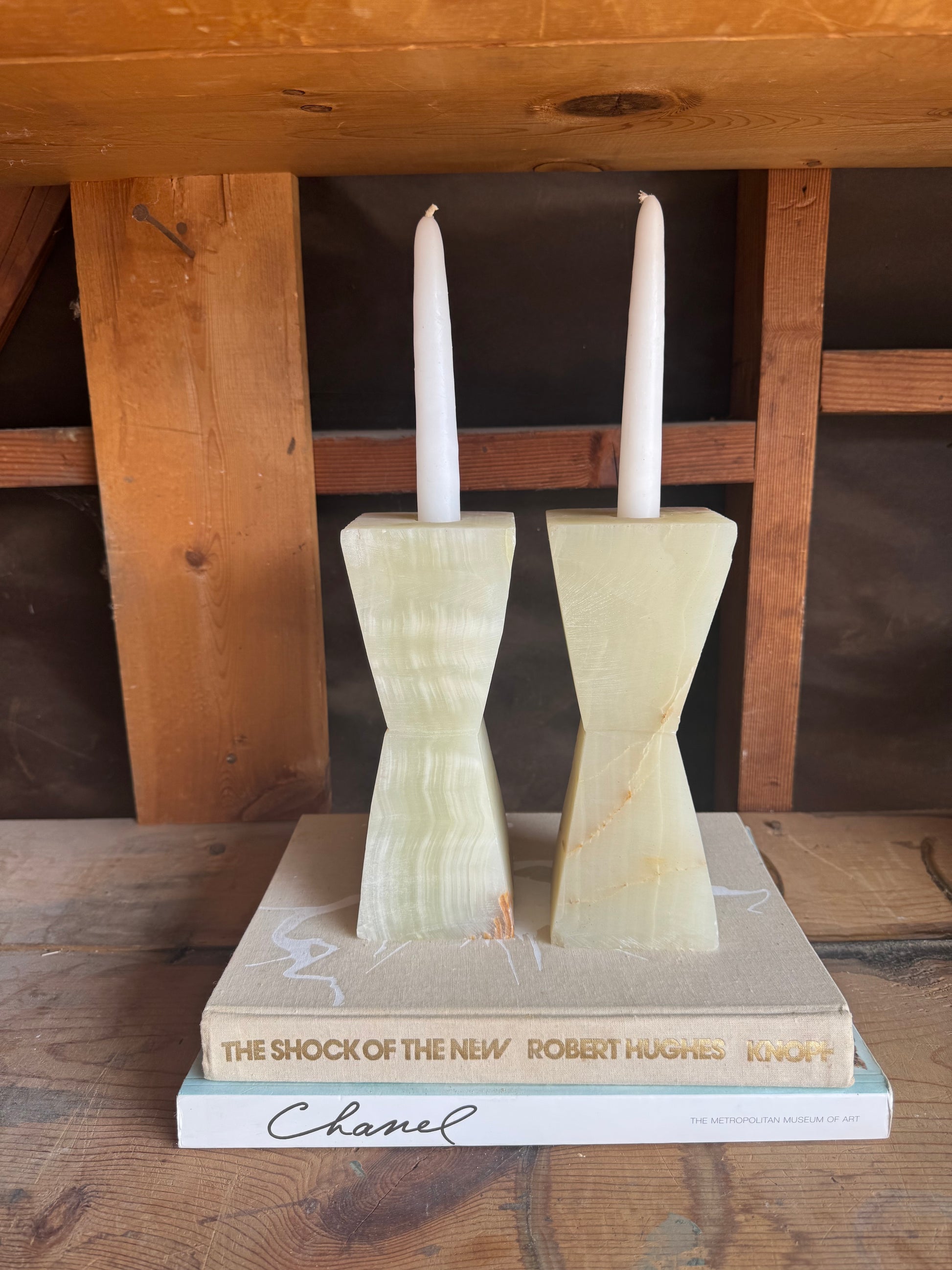 SAÉA onyx taper holders photographed in studio lighting with textured surface