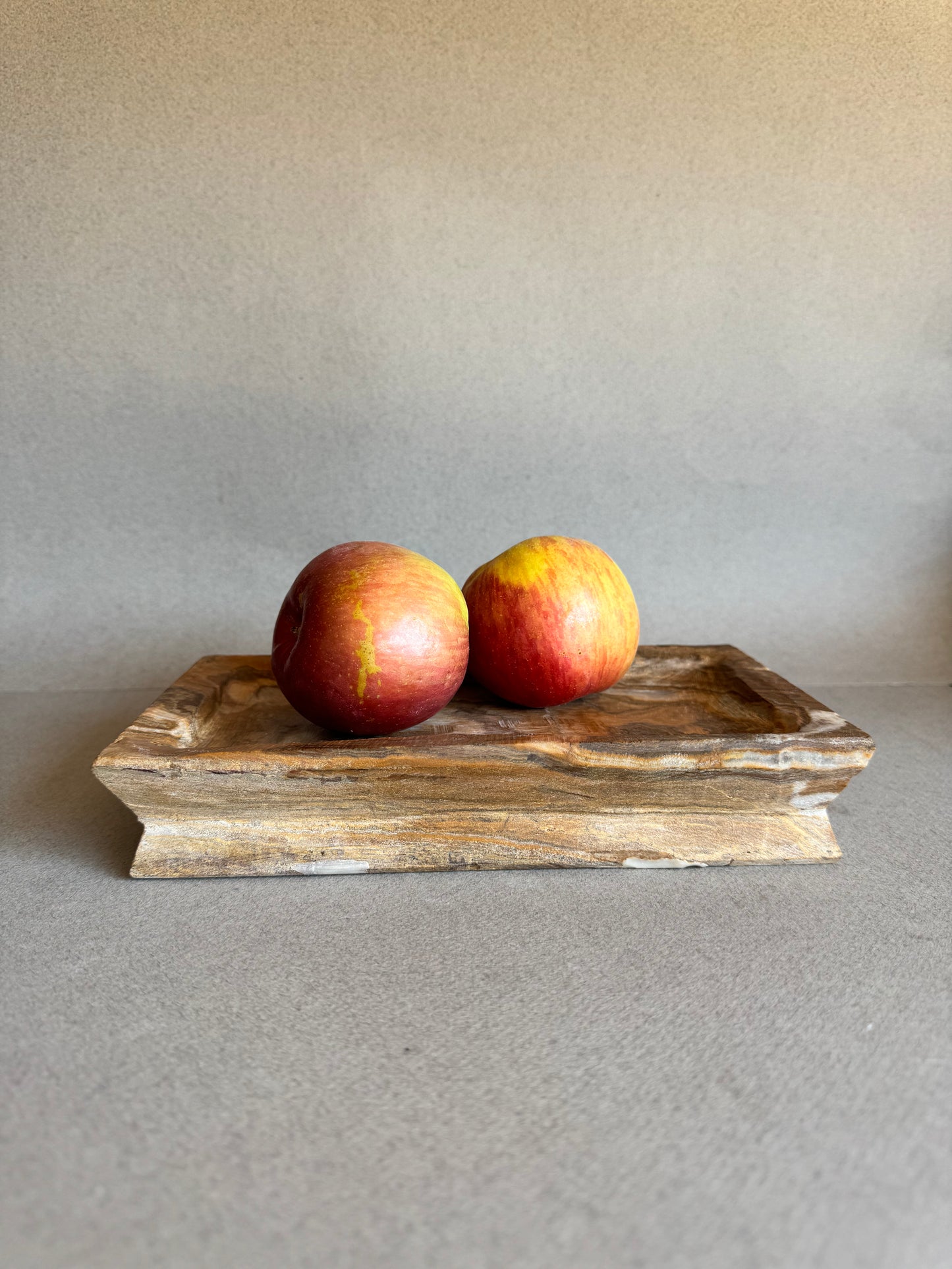 SAÉA catchall tray styled with apples to show scale and function