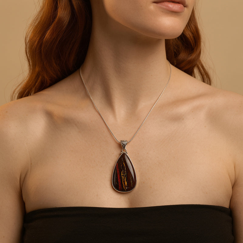 Navy, rust and copper pietersite teardrop pendant in sterling silver on a fine sterling silver snake chain, worn at the neckline
