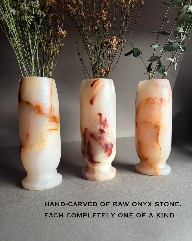 Three blush and ivory onyx stone vases labeled A B C, tall 8x3 hand carved Origin vases with natural pink and amber veining