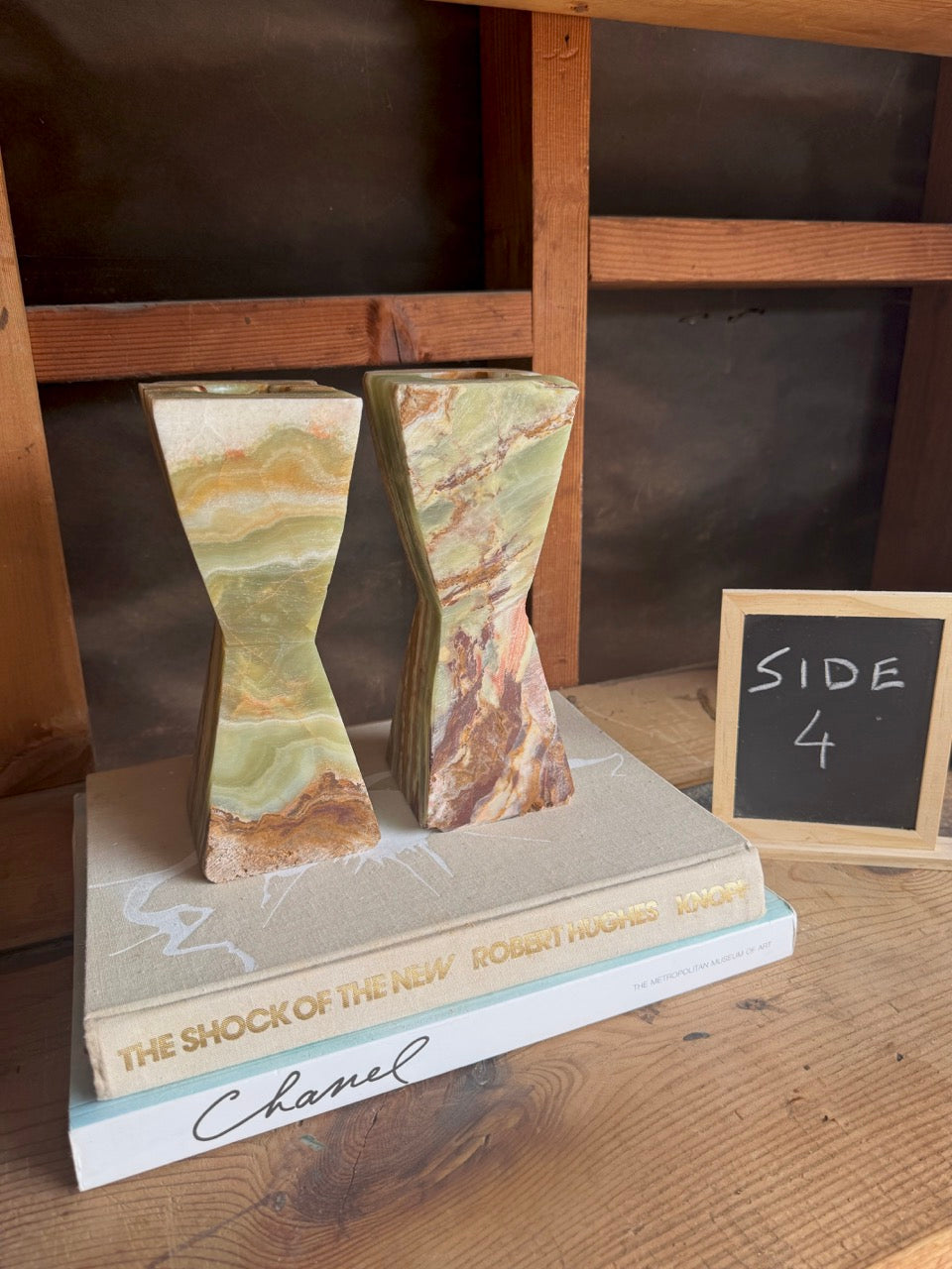 Earth-toned onyx candle holders with natural veining in a desert-inspired palette