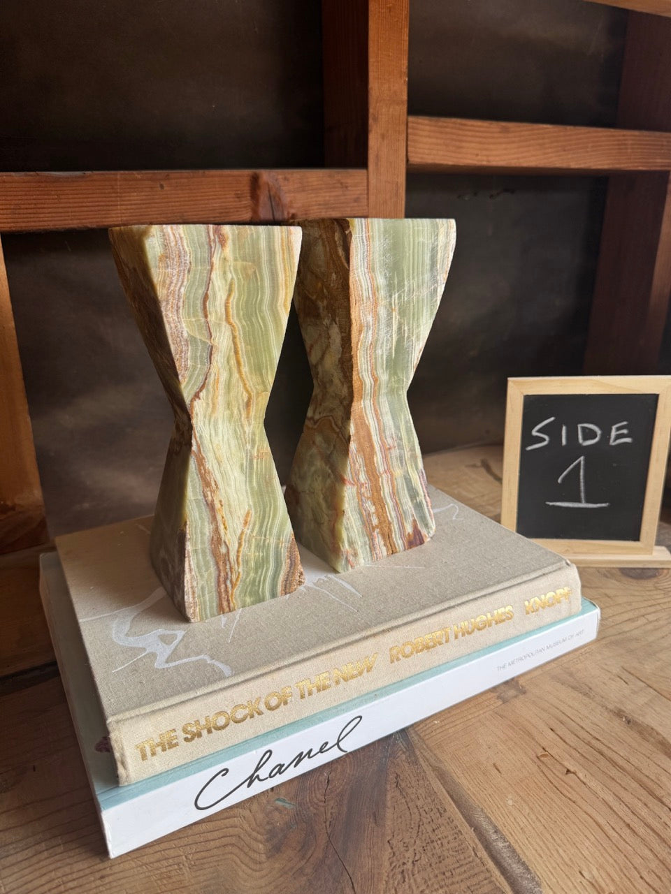 SAÉA onyx candle holders styled on books