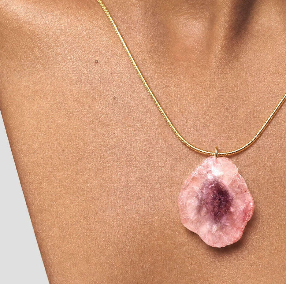 gold snake chain Necklace with a pink agate pendant on a white background