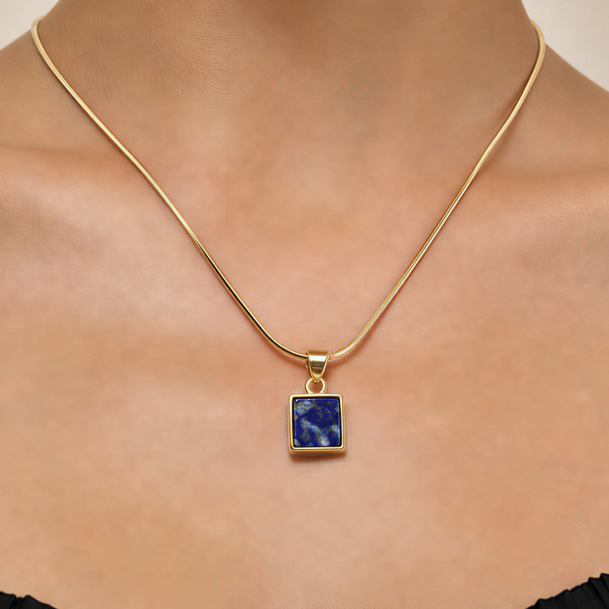 blue lapis lazuli necklace on a gold snake chain
