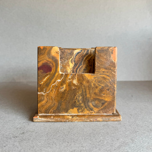Front view of square onyx holder in ochre, maroon, and espresso veining