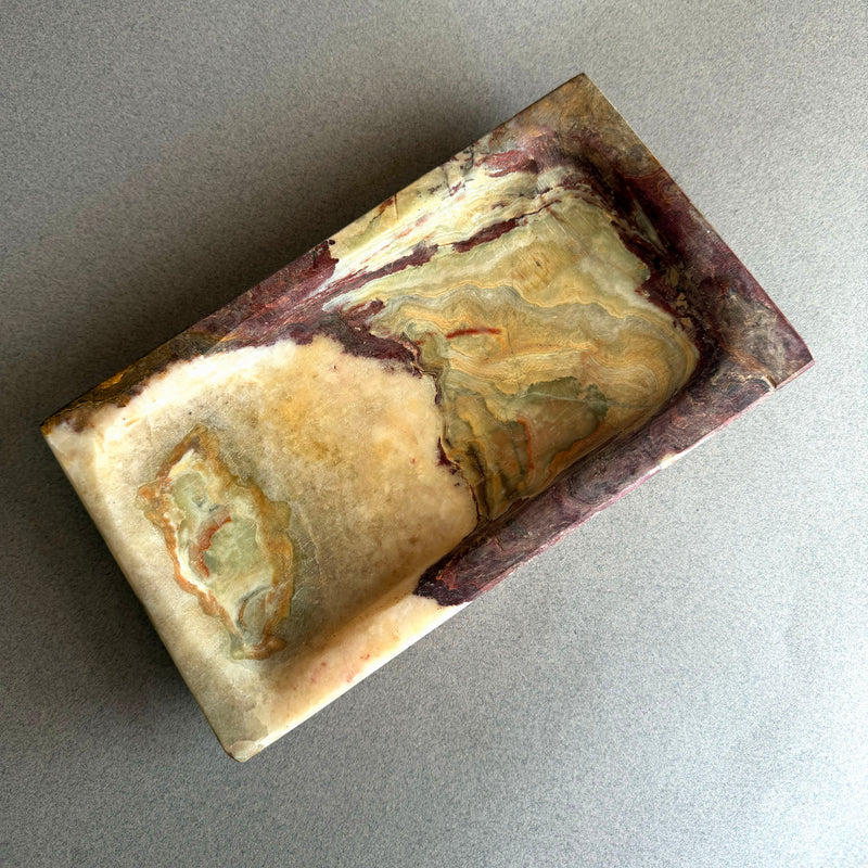 Rectangular natural onyx tray featuring deep plum, brown, and cream stone layers with stepped edge design