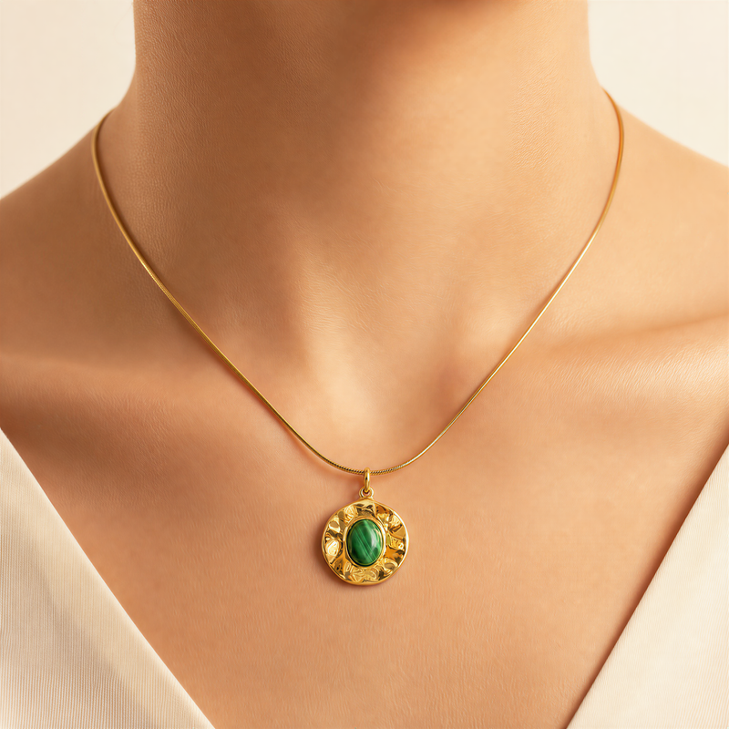 Gold necklace with a green pendant on a white model, 14k Gold Filled necklace with a green malachite pendant on a mannequin bust.
