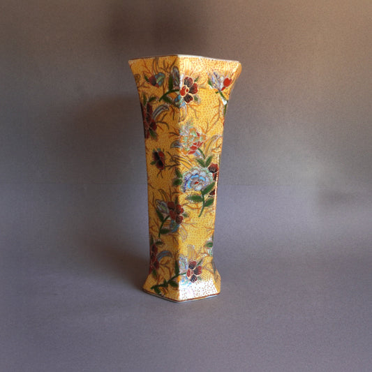 Decorative vase with floral patterns on a gray background