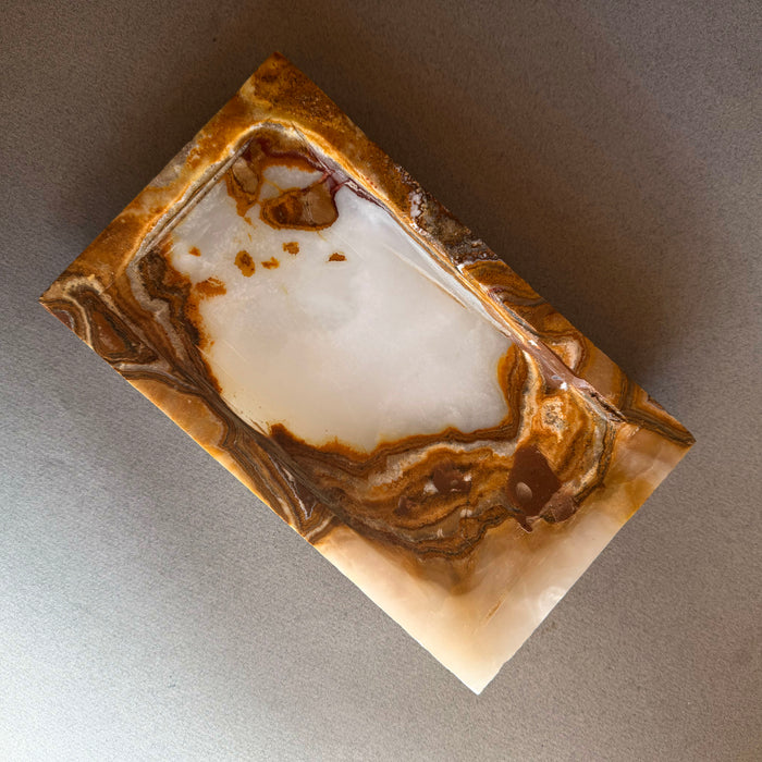 Rectangular ivory onyx stone tray with bold brown veining and organic banding, handmade natural stone catchall tray