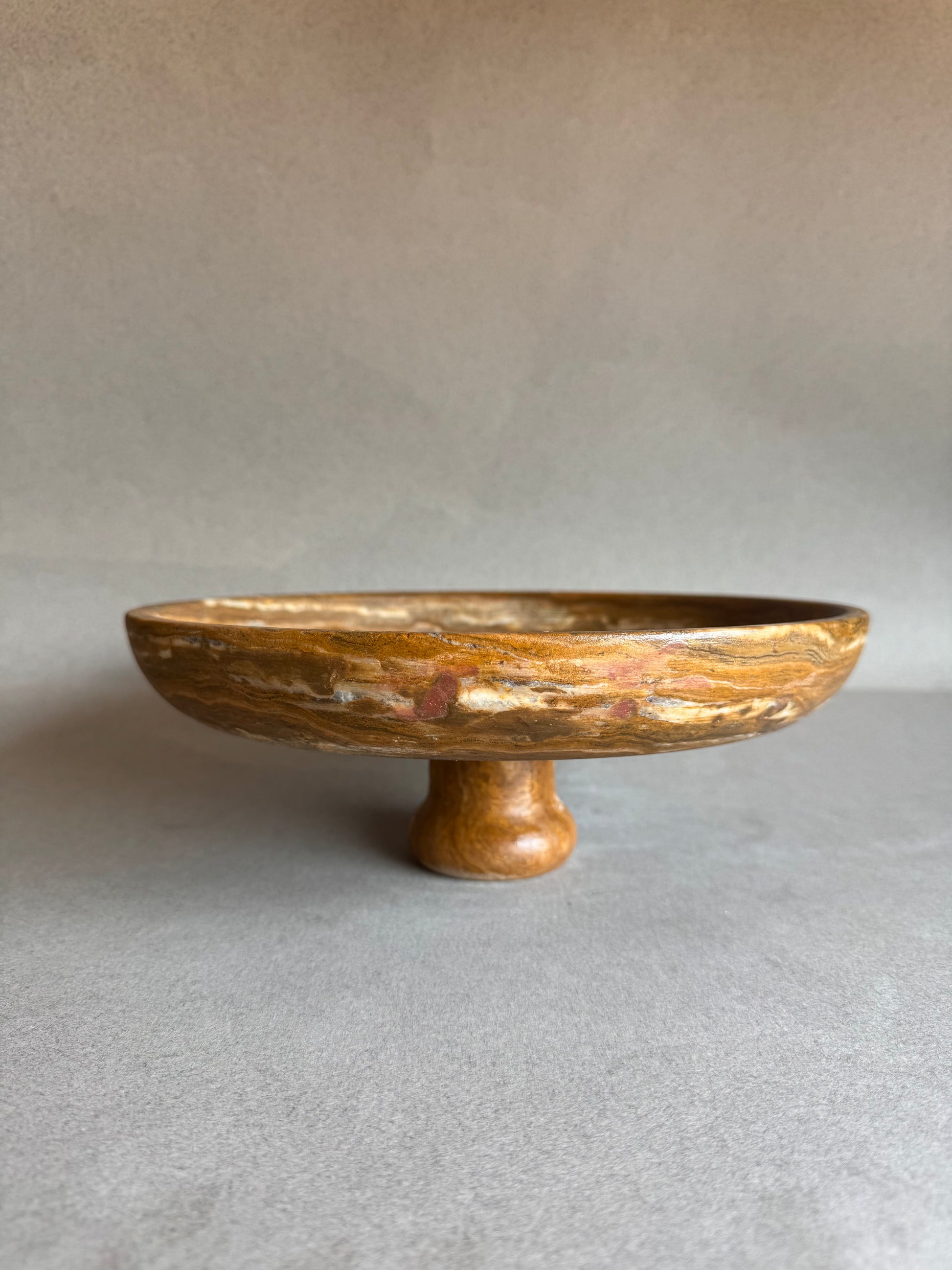 Stone bowl on a gray background