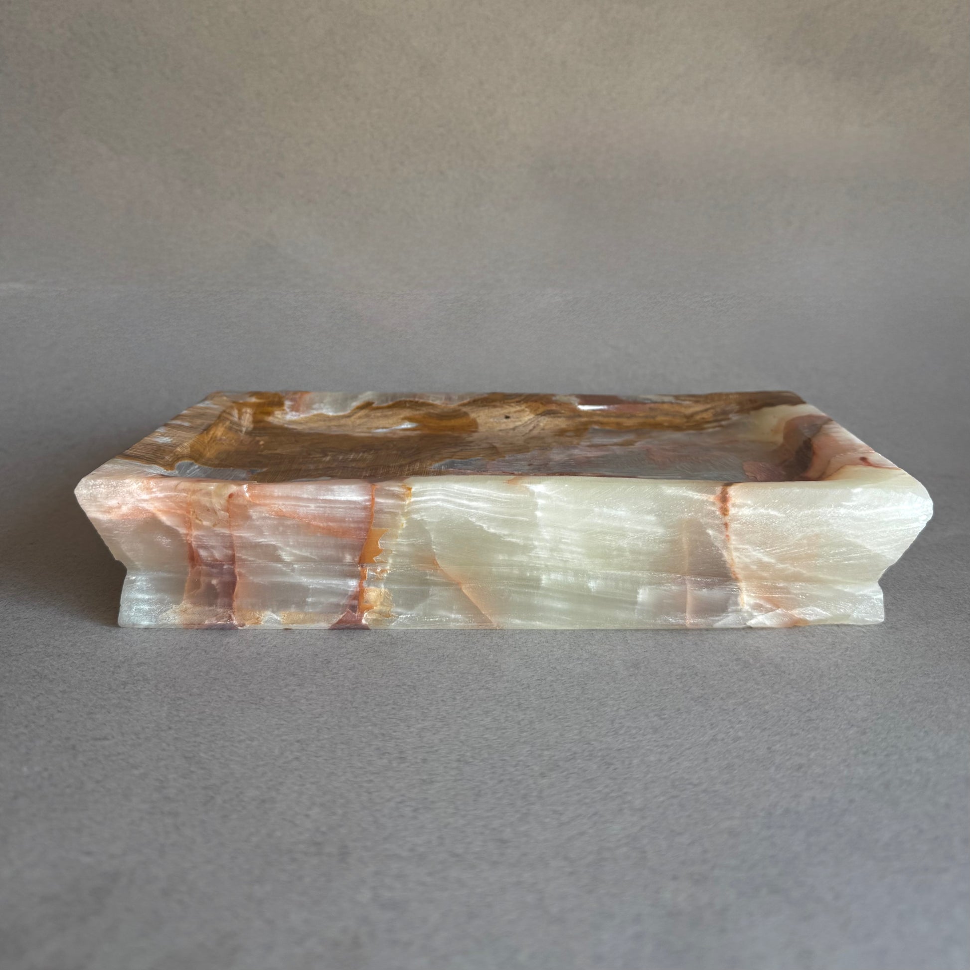 Decorative stone tray with a natural pattern on a gray background