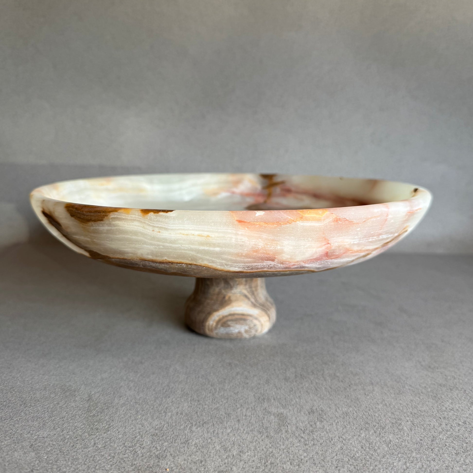 Decorative stone bowl on a gray background