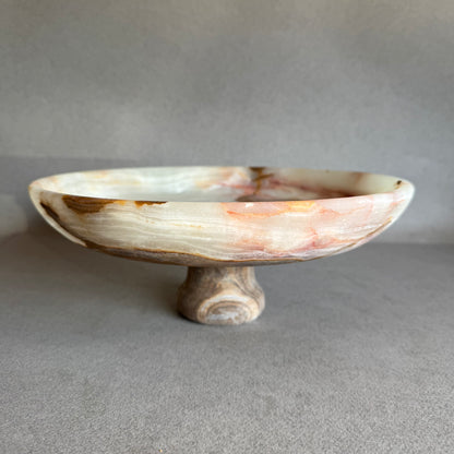 Decorative stone bowl on a gray background