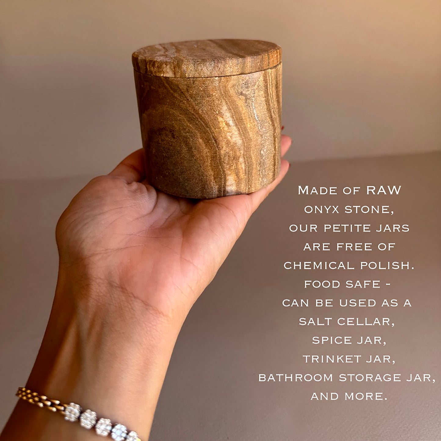 Hand holding a onyx stone jar with text about its uses and material