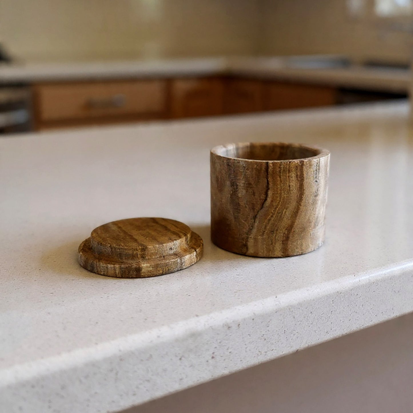 Wooden container with lid on a kitchen counter