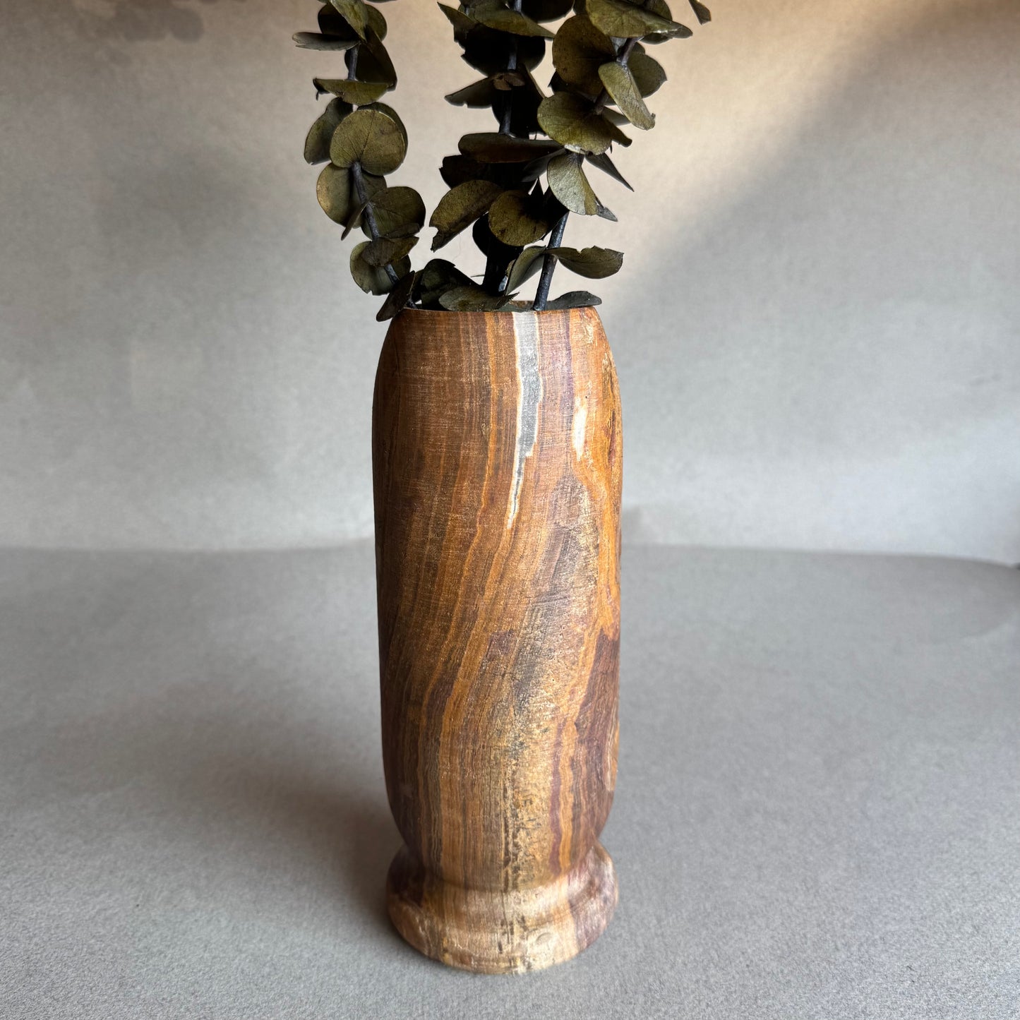 Earthy home decor accent with hand-carved onyx vase


