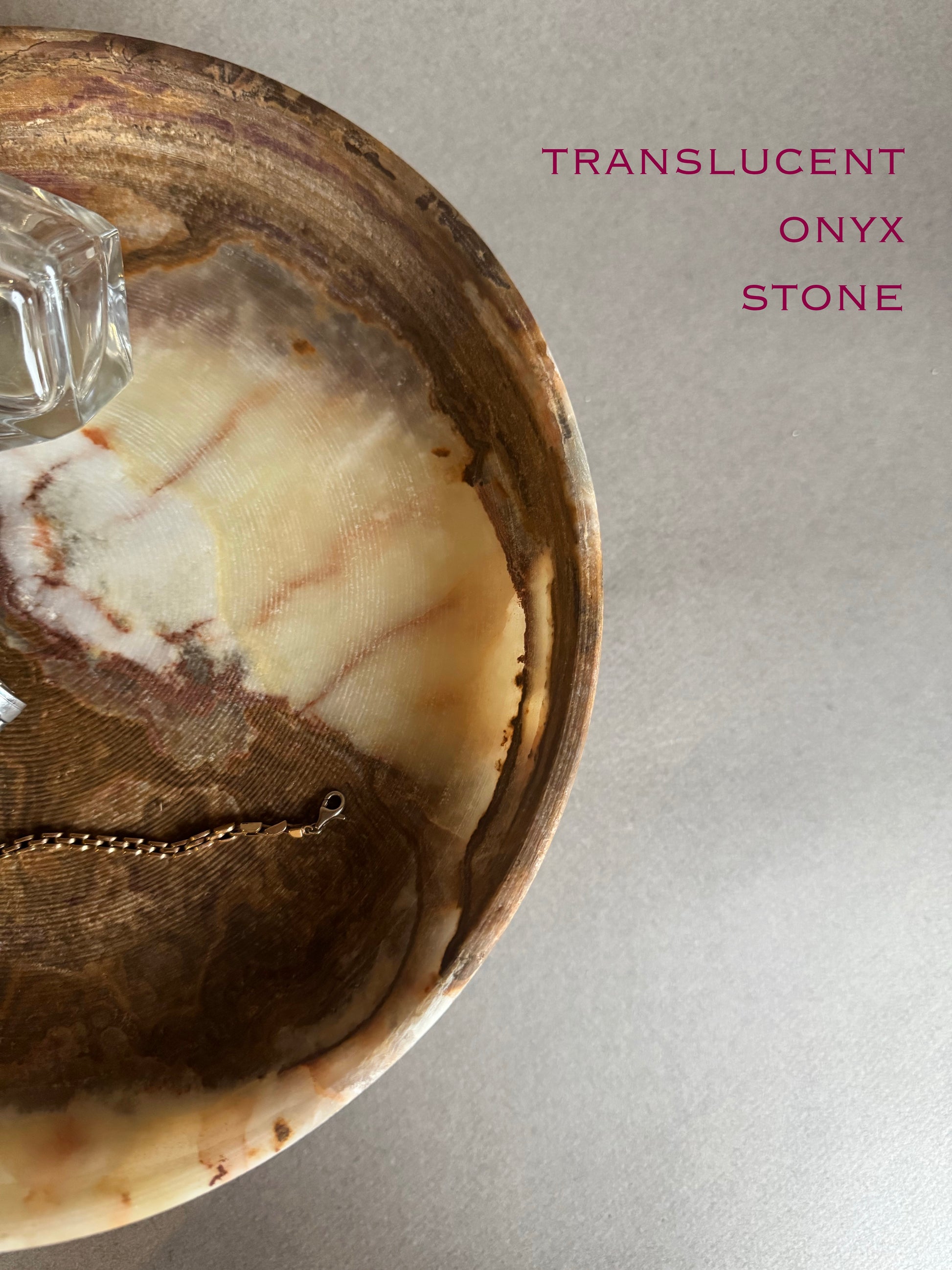 Translucent onyx stone in a wooden bowl with text 'Translucent Onyx Stone' on a gray background