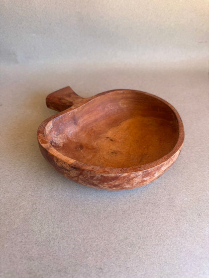 Vintage mushroom-shaped wooden bowl with sculptural handle and natural patina, hand-carved rustic catchall dish.