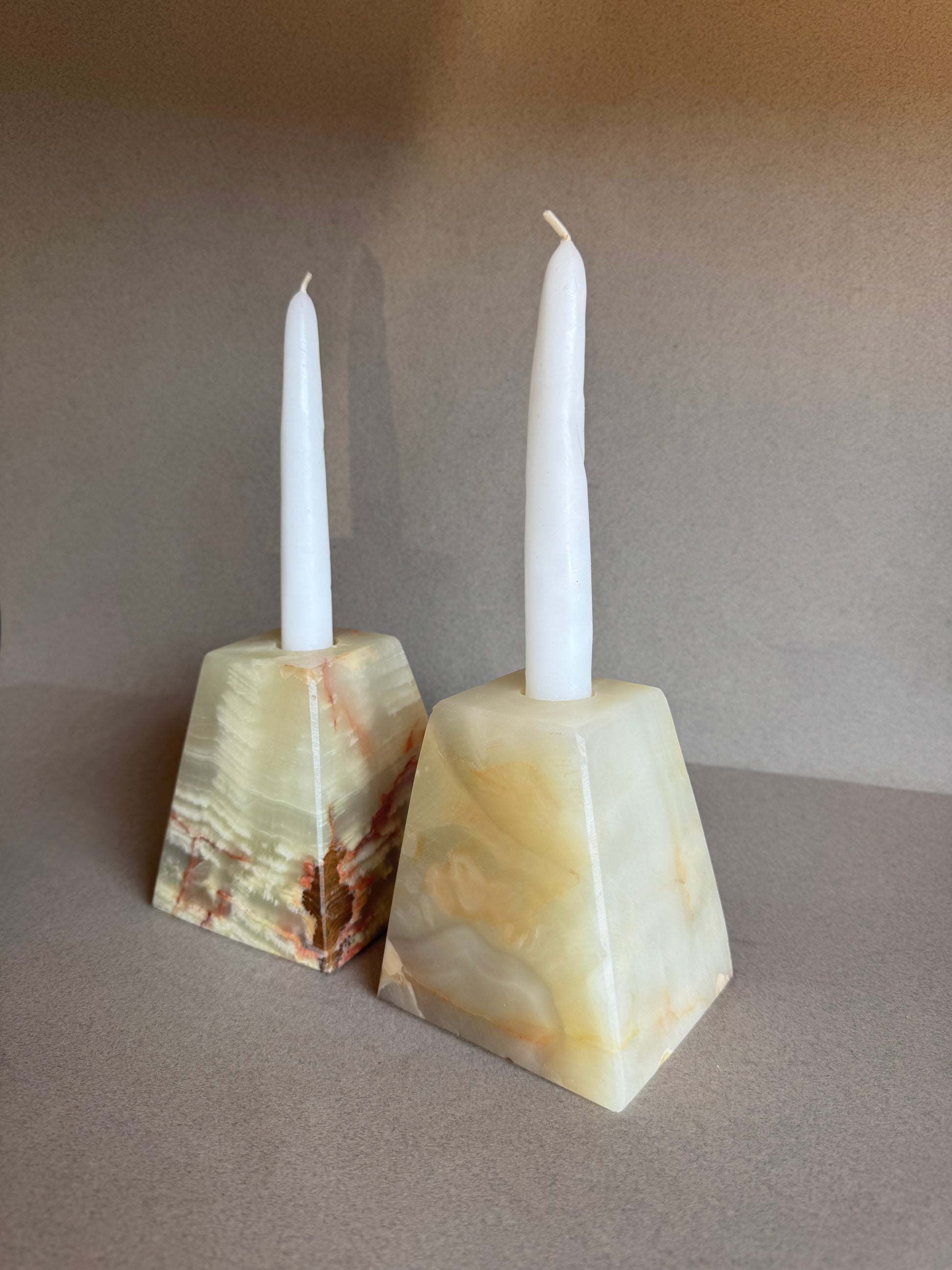 Pyramid candle holders with complementary taper candles and SAÉA tote

