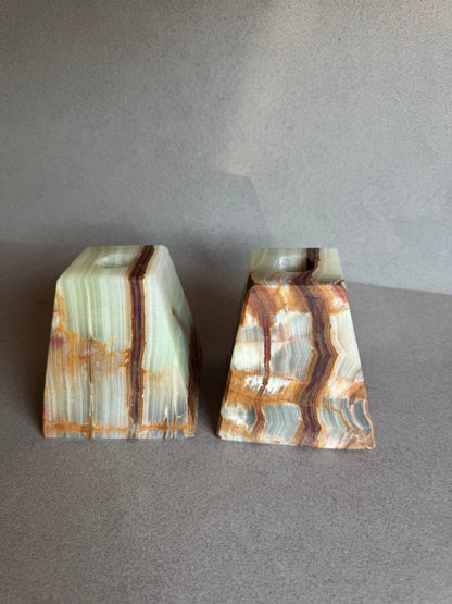 Two pieces of agate on a gray background