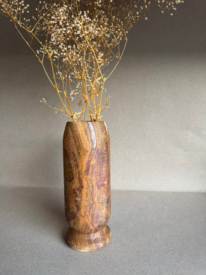 Brown stone vase with baby’s breath 
