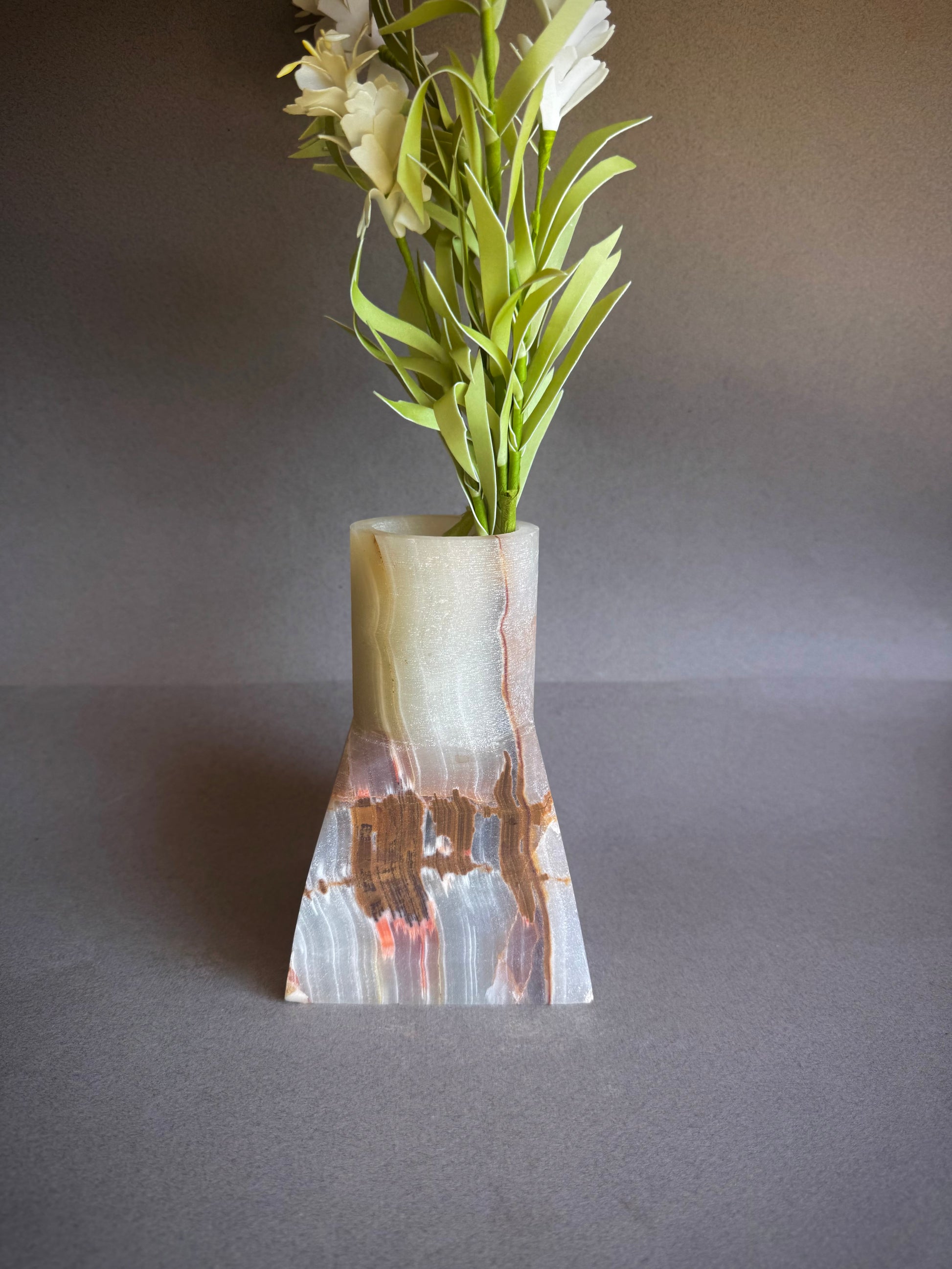 Stone Vase with a unique design on a gray background