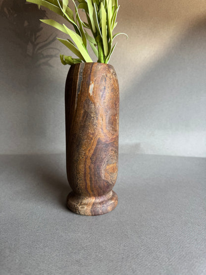 Natural stone vase in golden sand and deep brown tones

