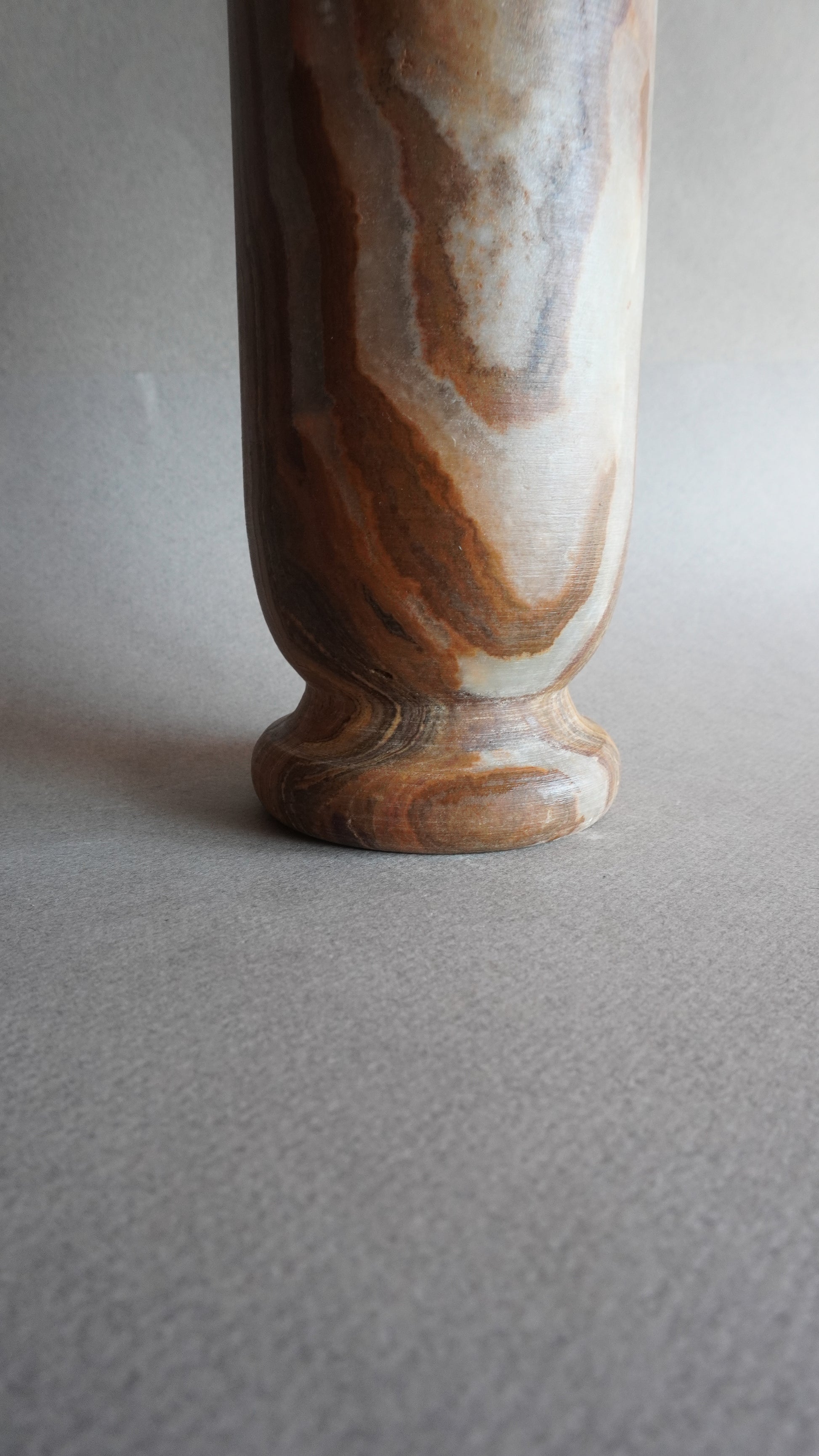 Marble-patterned vase on a plain background