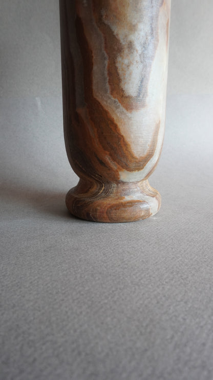 Marble-patterned vase on a plain background