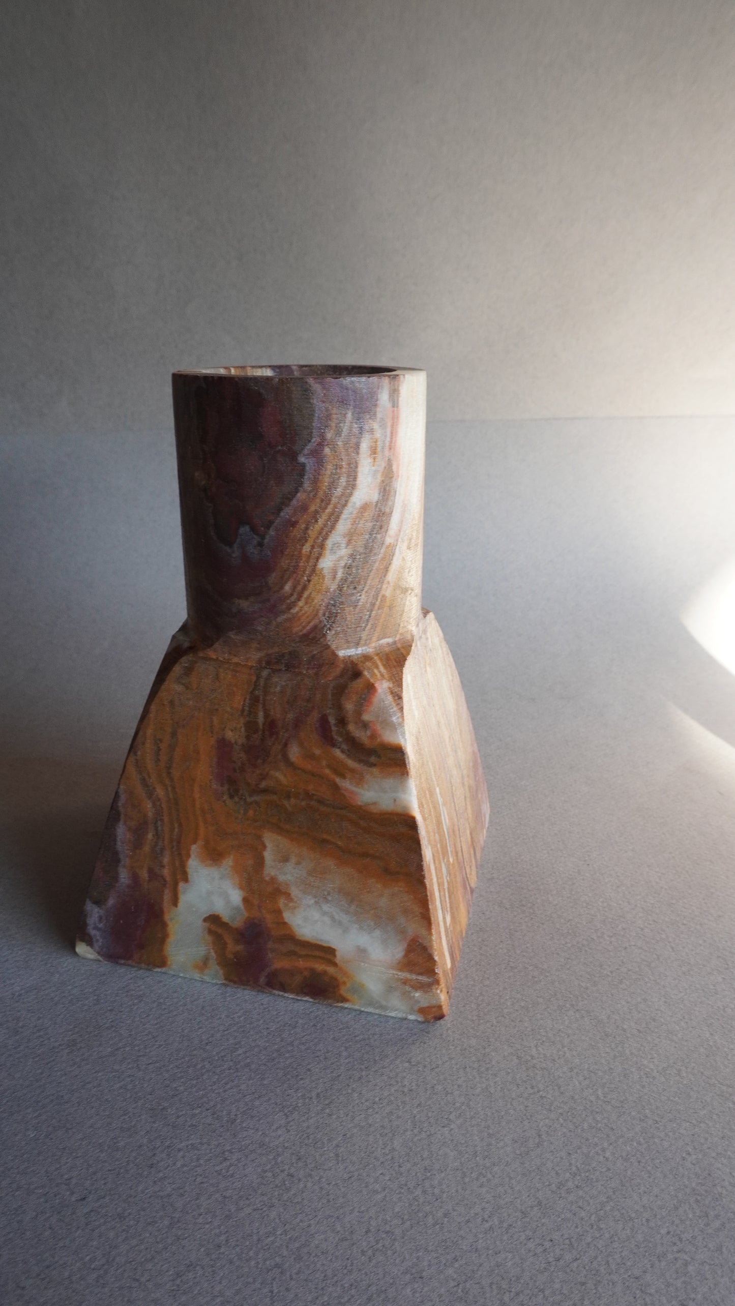 Decorative stone sculpture on a gray background