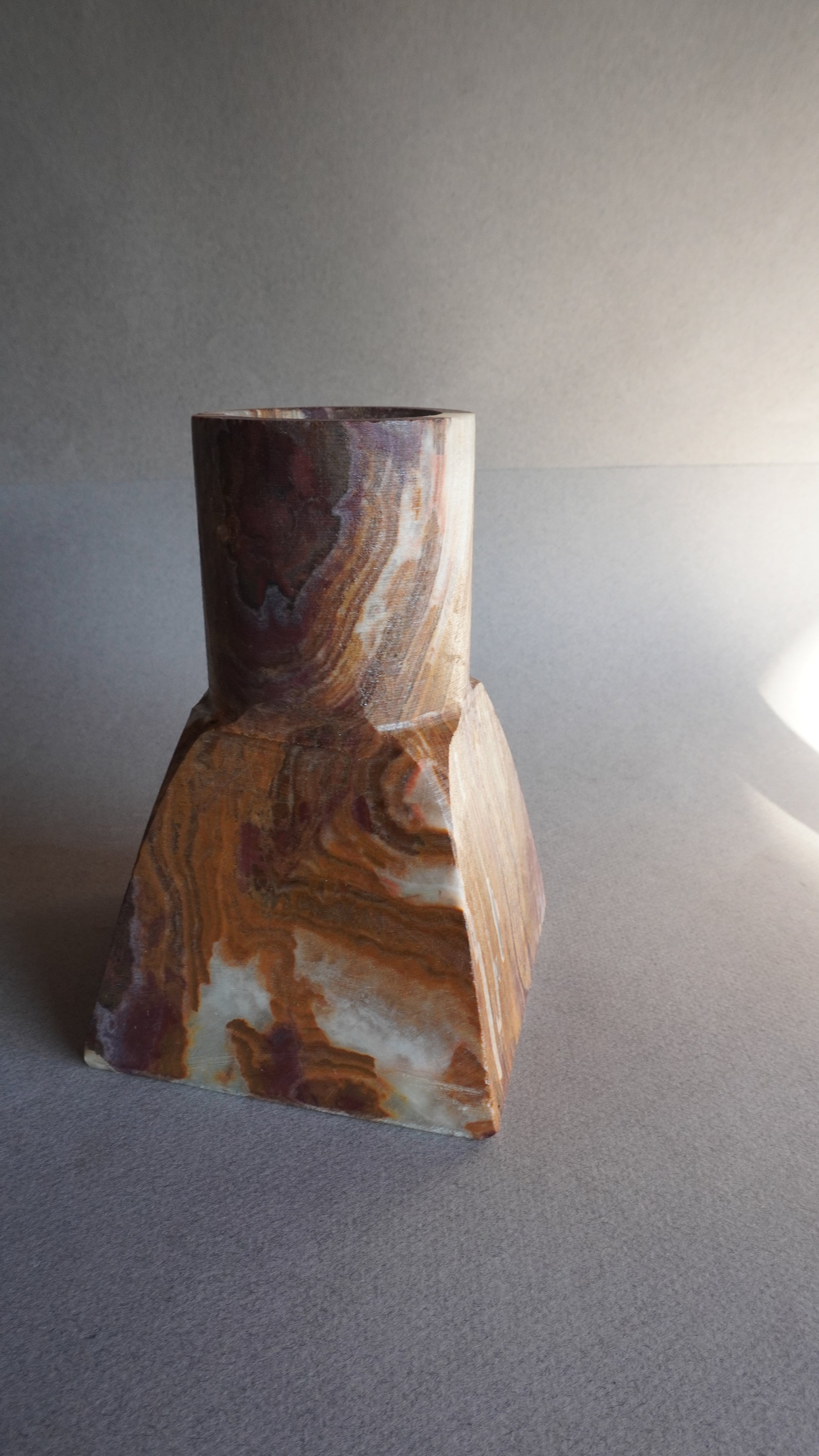 Decorative stone sculpture on a gray background