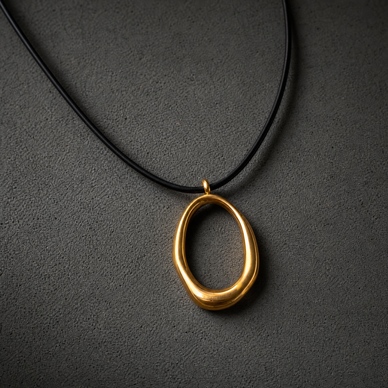 SAÉA Gold Filled Freeform Gold Oval Pendant Necklace on Black Cord