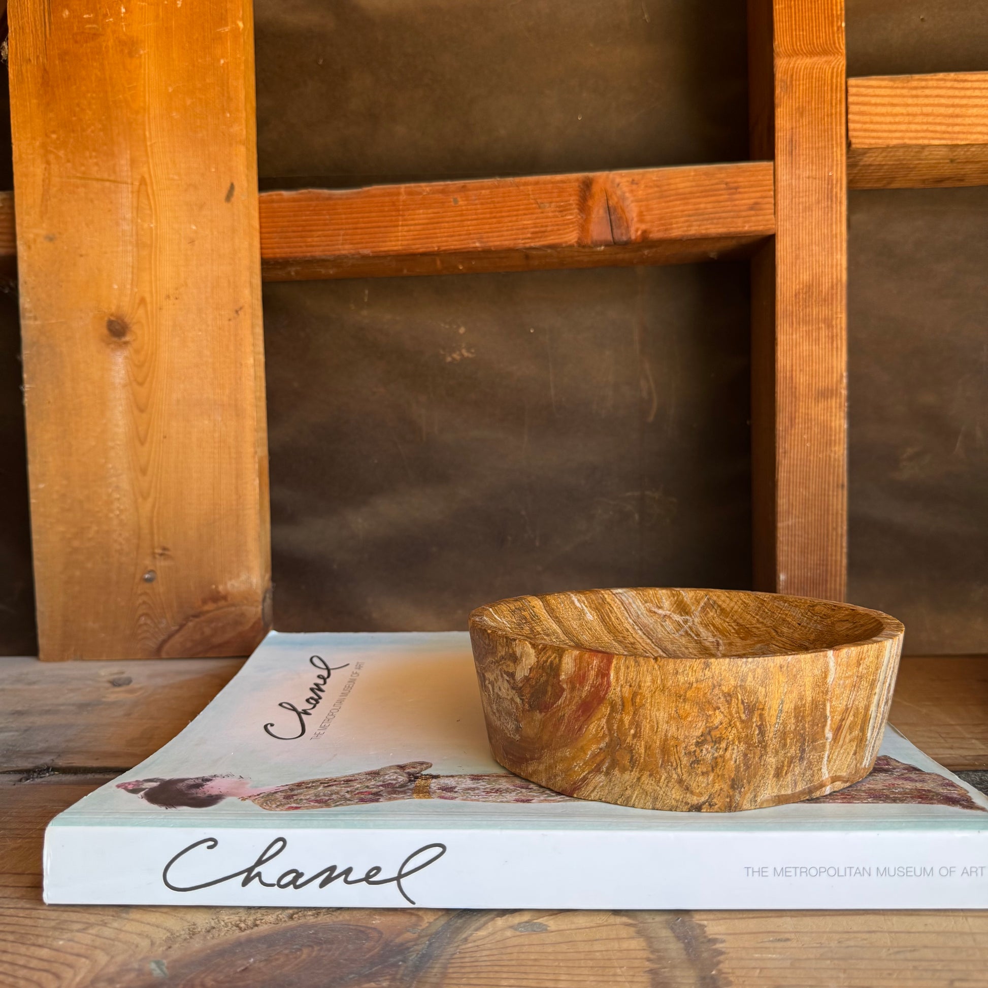 Side profile of hand-carved onyx catchall bowl in warm desert-inspired tones