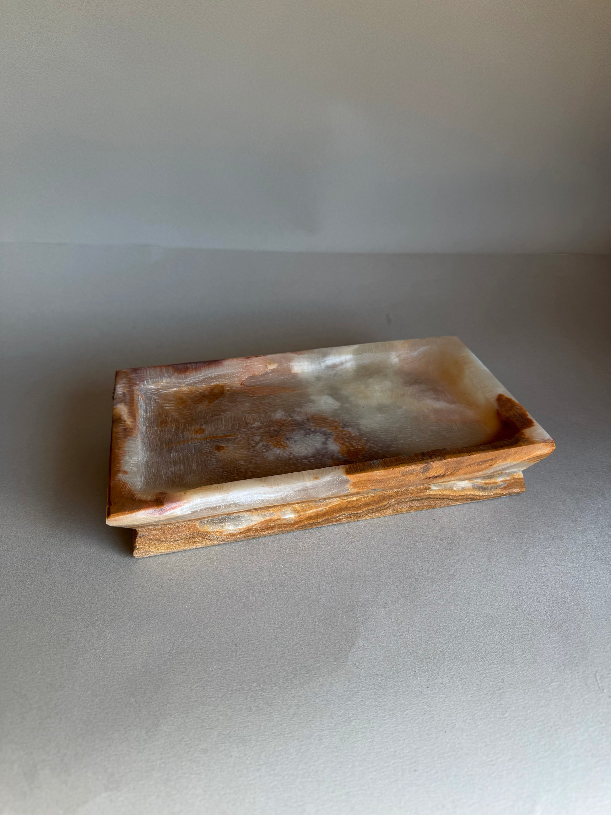 Rectangular stone dish on a gray background
