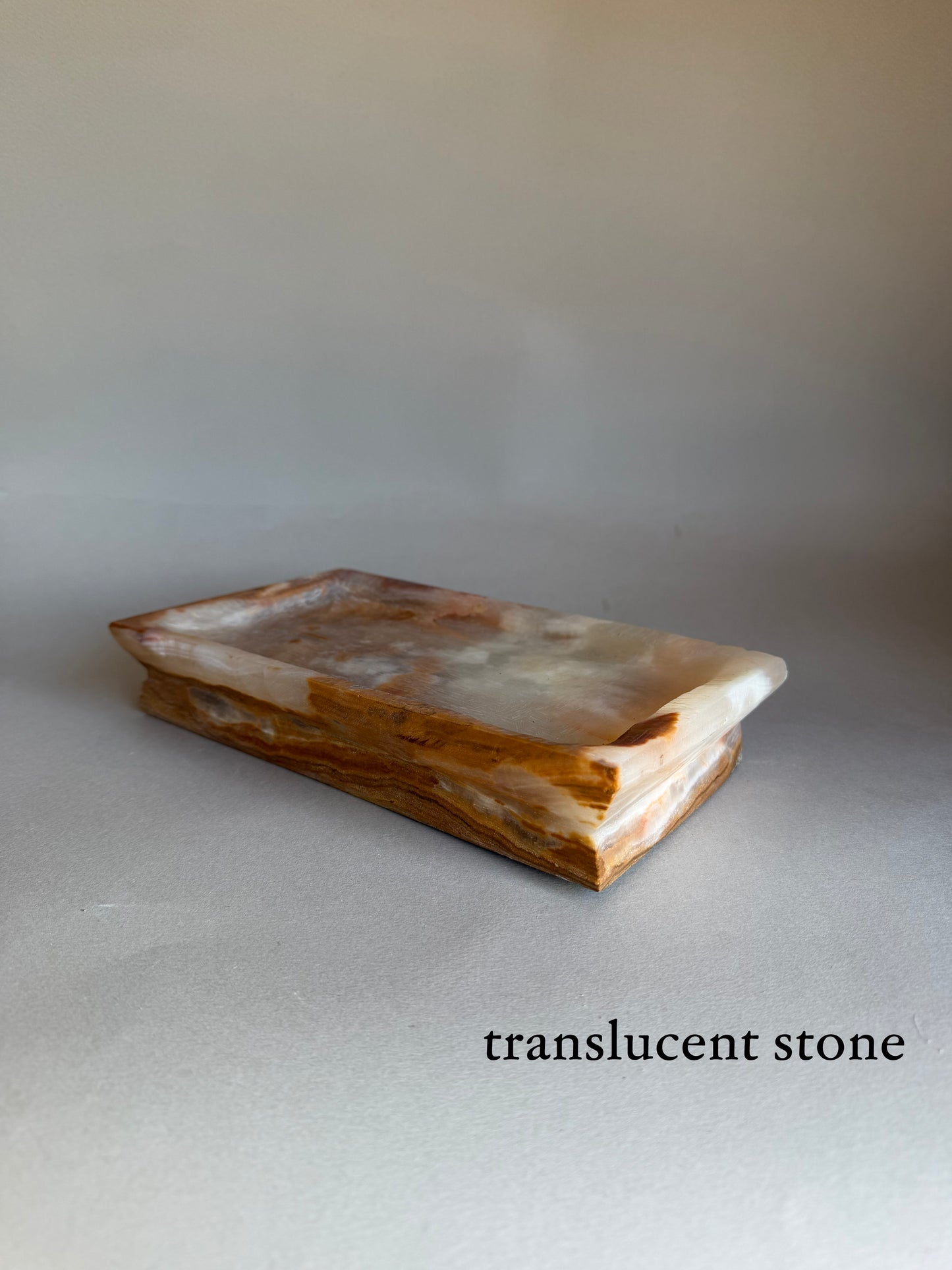 Translucent stone on a gray background with text 'translucent stone'.