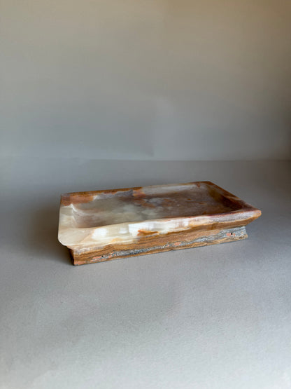Rectangular stone tray on a plain background