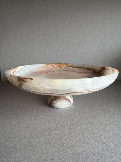 Close-up of rim and inner surface of onyx bowl, showing detailed sage and ivory veining