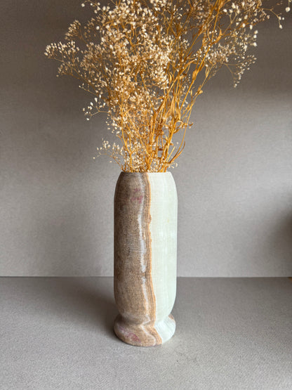 Vase styled with dried baby’s breath florals, standing tall against a neutral backdrop.

