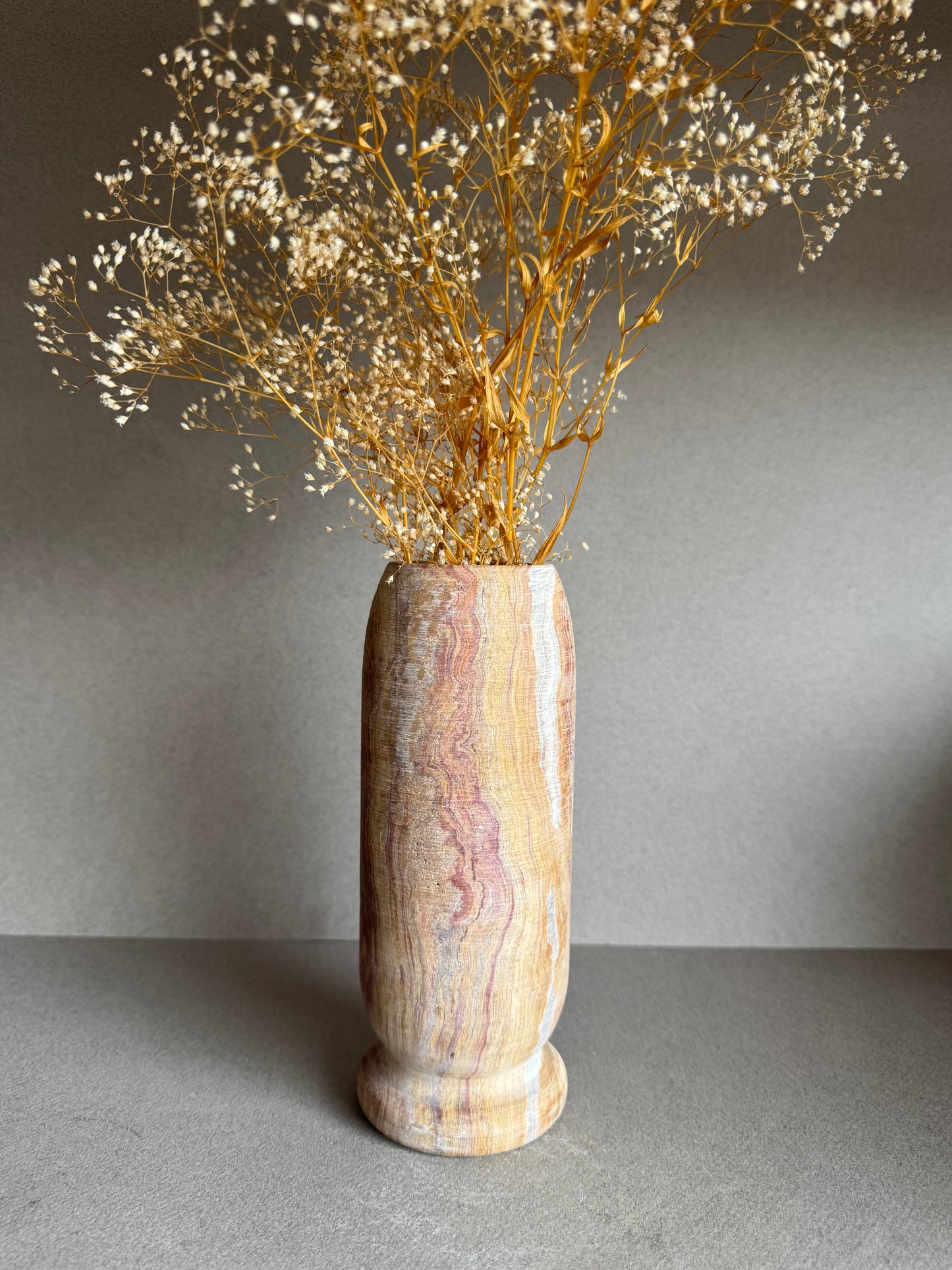 Floral-styled shot showing veining across warm sandstone hues and minimalist design.

