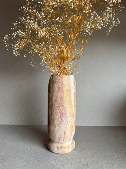 Floral-styled shot showing veining across warm sandstone hues and minimalist design.

