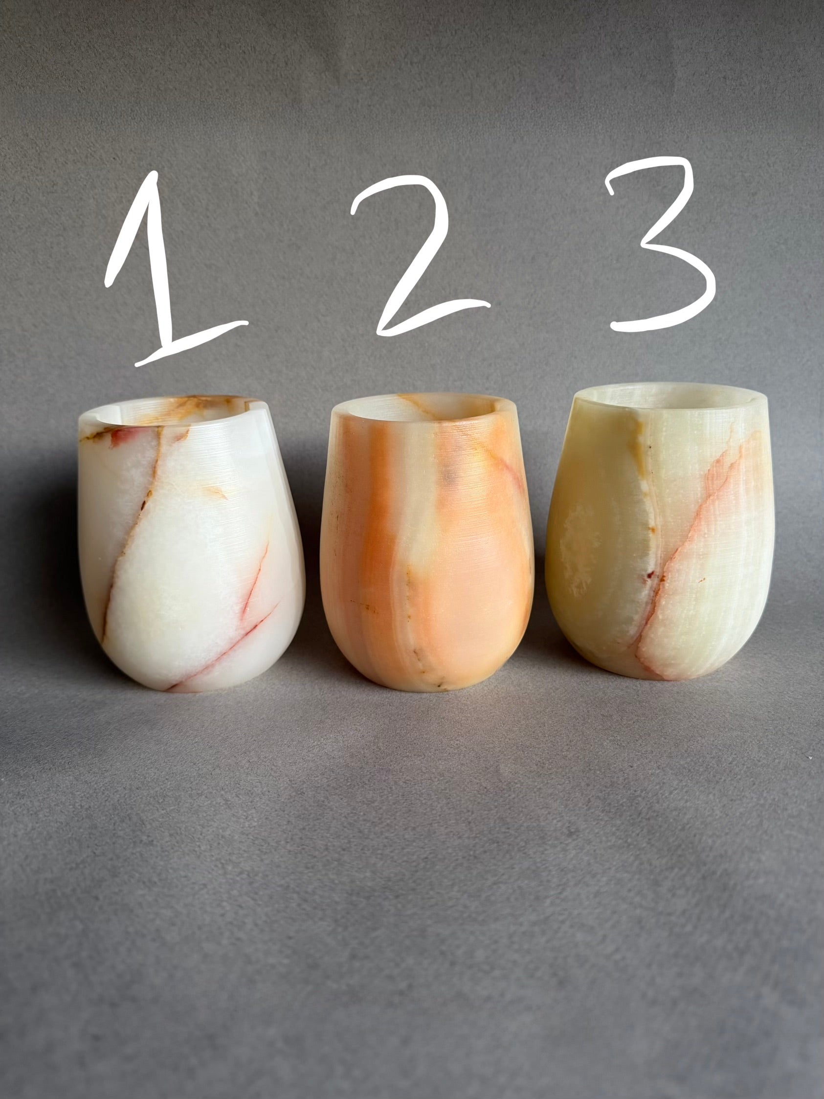 Three marble-textured onyx brush cups pen holder jars labeled 1, 2, and 3 on a gray background
