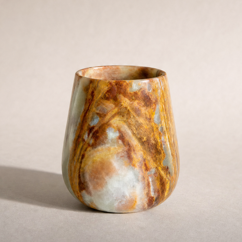 Marble-patterned jar on a neutral background