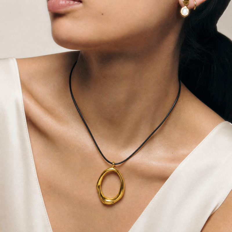 SAÉA Gold Filled Freeform Gold Oval Pendant Necklace on Black Cord