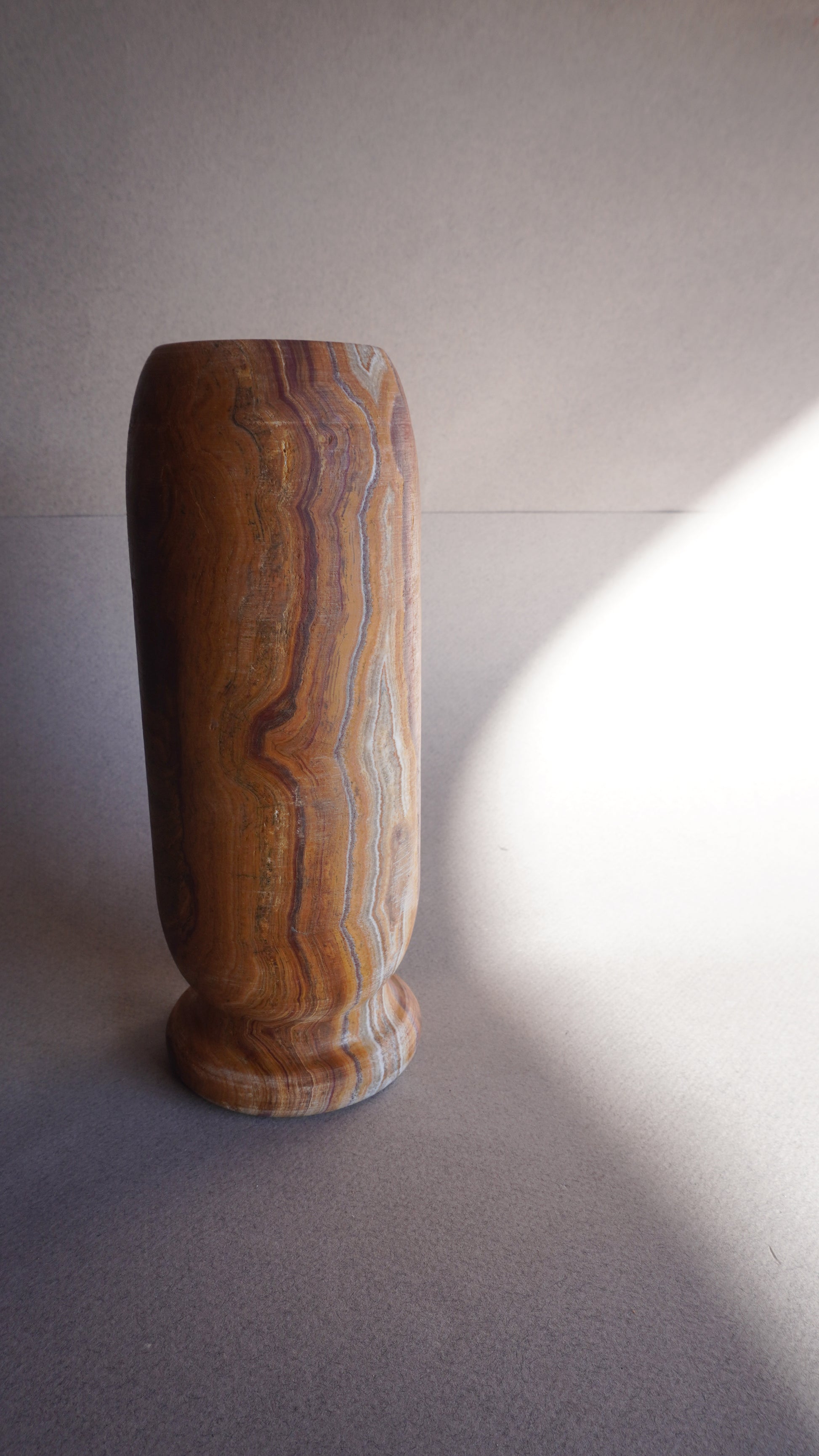 Handmade brown onyx vase styled with dried florals, unique stone home accent

