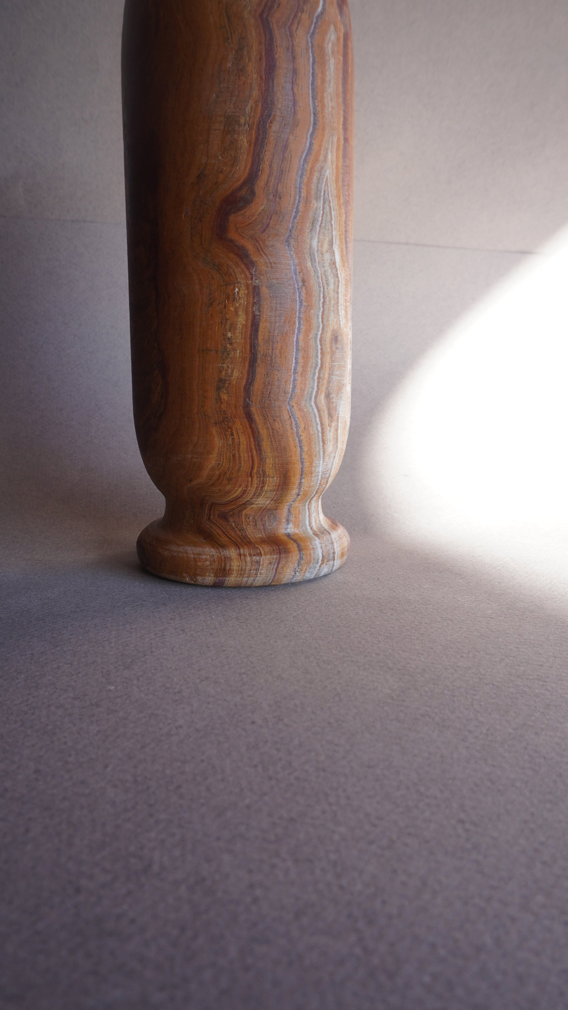 Side view of tall onyx vase, marbleized stone vase for minimalist and boho interiors
