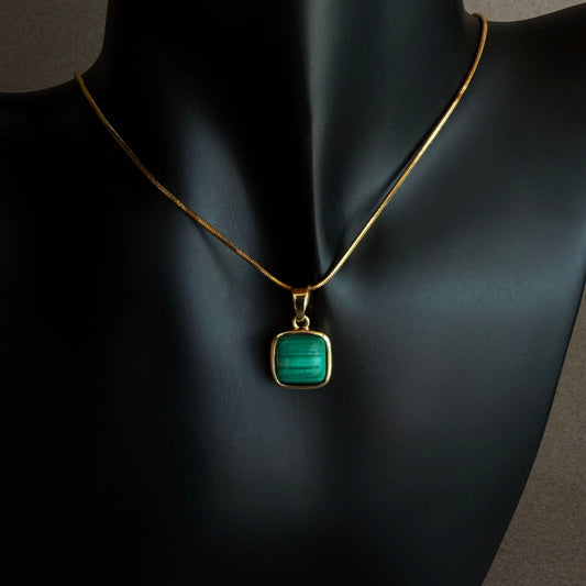 Malachite pendant necklace on 18 inch gold filled snake chain worn on black sculptural bust, green stone minimalist jewelry
